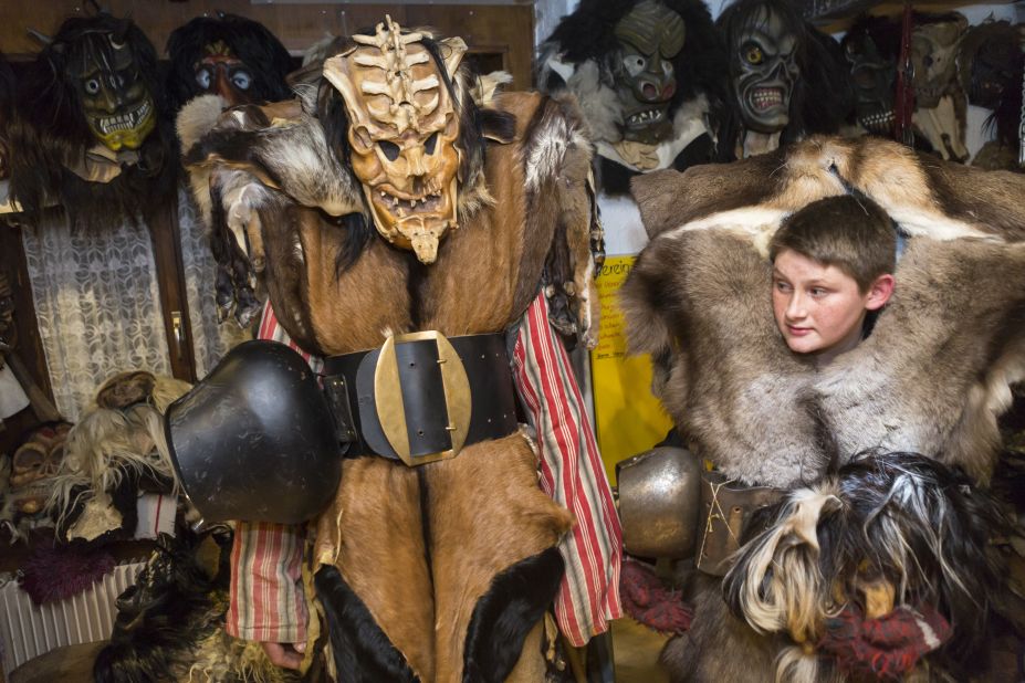 Carnival participants don wooden masks and animal furs to scare residents in the Swiss village of Blatten on February 12. 