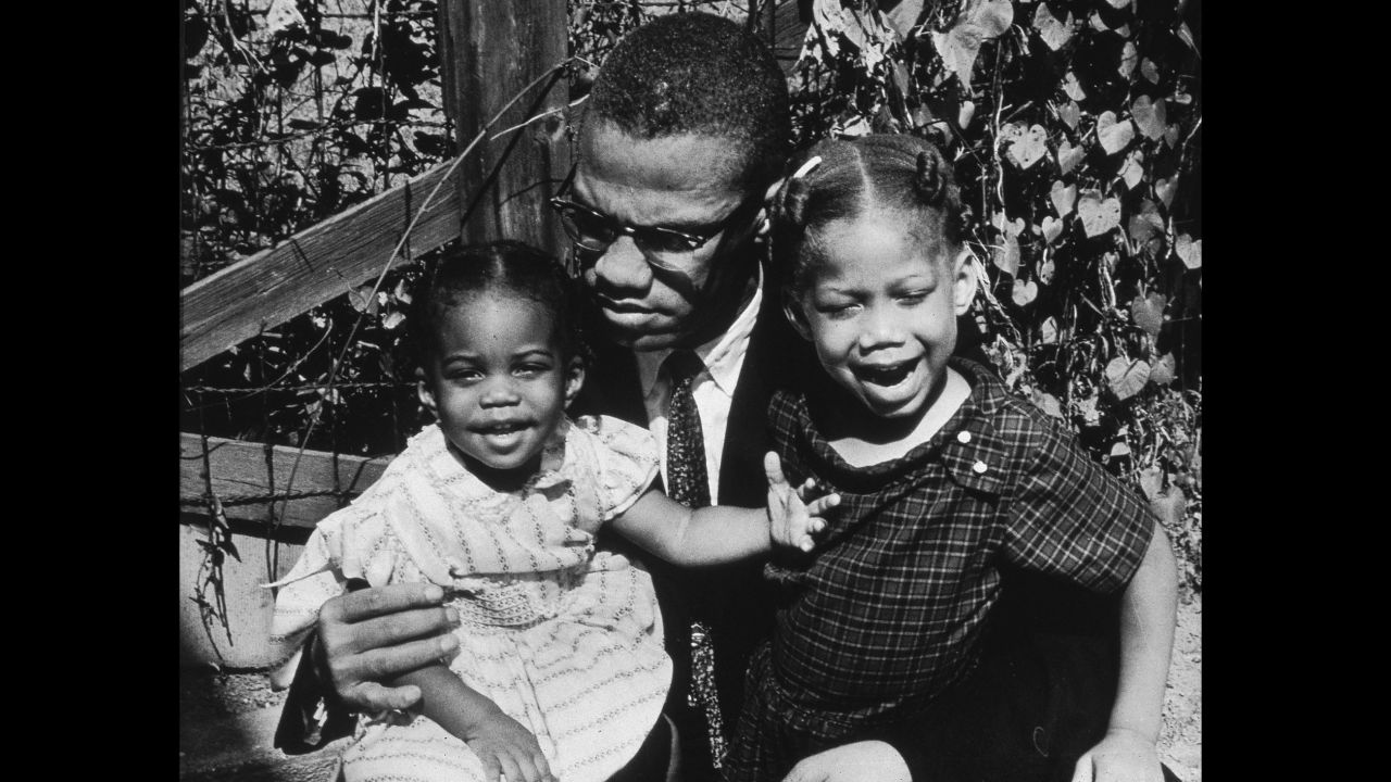 Malcolm X with his daughters Qubilah, left, and Attilah in 1963.