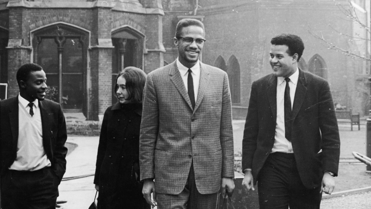In December 1964, Malcolm X meets with students before the Oxford Union Debates in Oxford, England. He would be assassinated less than two months later.