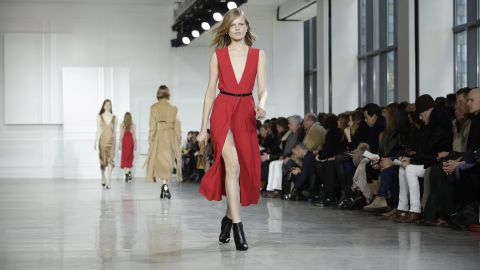 Model Hanne Gaby Odiele walks for Jason Wu in a seductive silk dress with a thigh-high slit.