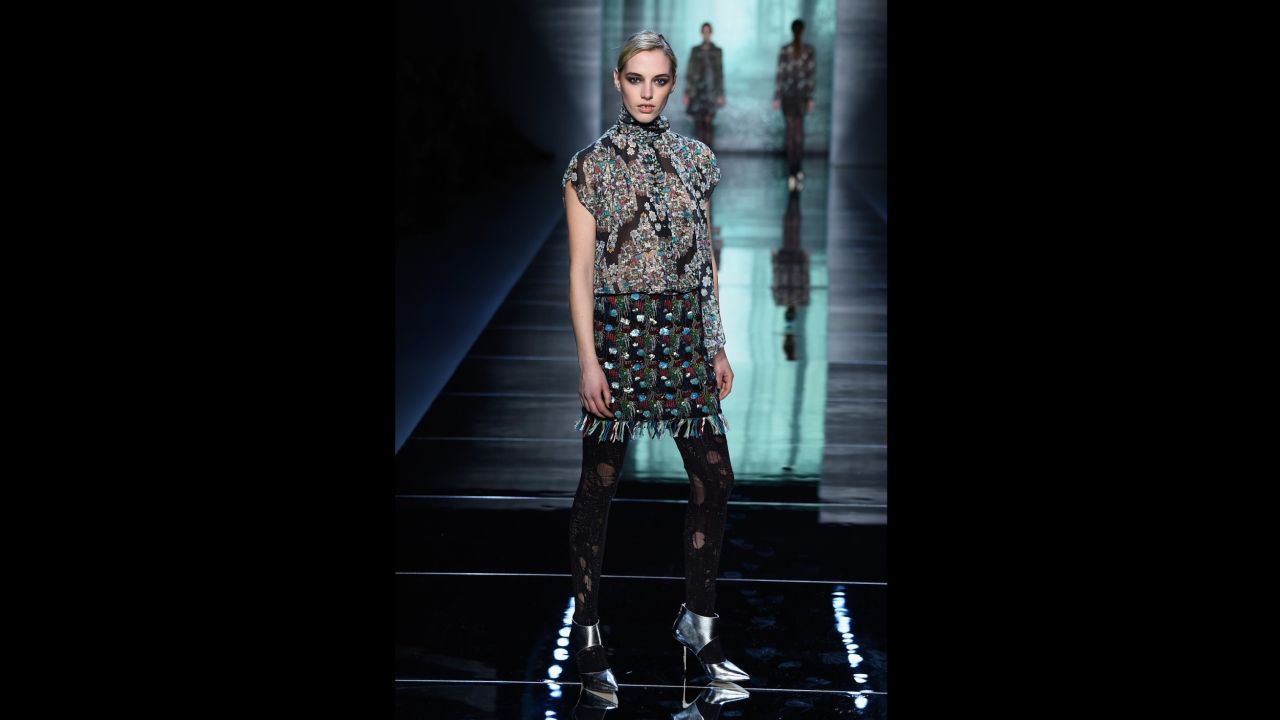 A model walks the runway for Nicole Miller's dark forest-inspired collection.