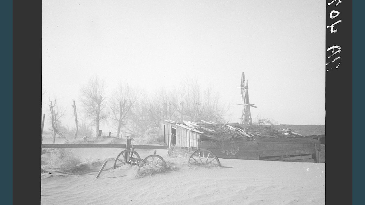 The Dust Bowl drought in the 1930s: Dust blows up dunes at Oklahoma farm.