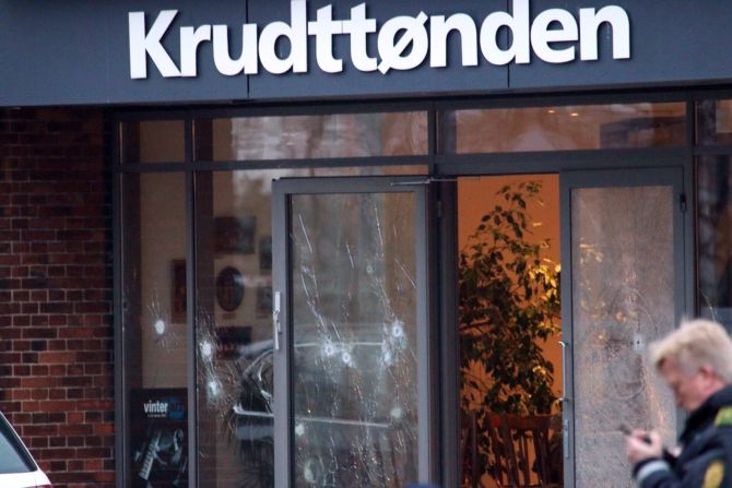Bullet holes can be seen in the doors of the venue that housed the event. The attackers made it into the lobby but apparently got no farther, according to journalist in attendance. 