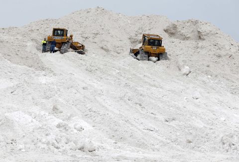 A pair of bulldozers rest on a giant pile at a "snow farm" in Boston on February 14.  