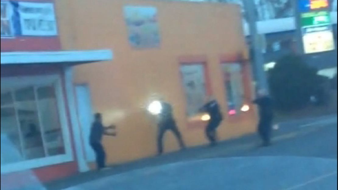 In an frame taken from a YouTube video posted by Dario Zuniga, Antonio Zambrano-Montes, 35, (far left) is seen immediately before he was fatally shot by Pasco, Washington, police officers who confronted him (three, to the right). 
