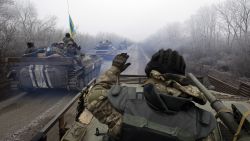 A convoy carrying Ukrainian forces drives to Debaltseve, Ukraine, on February 14.