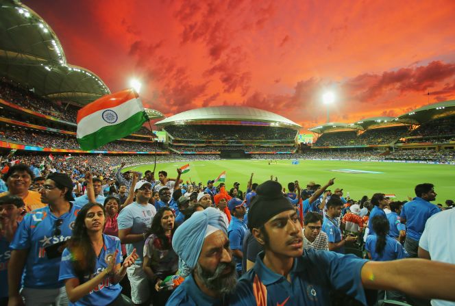 A bright red sky is the backdrop for Indian celebration at the historic Adelaide Oval in South Australia.
