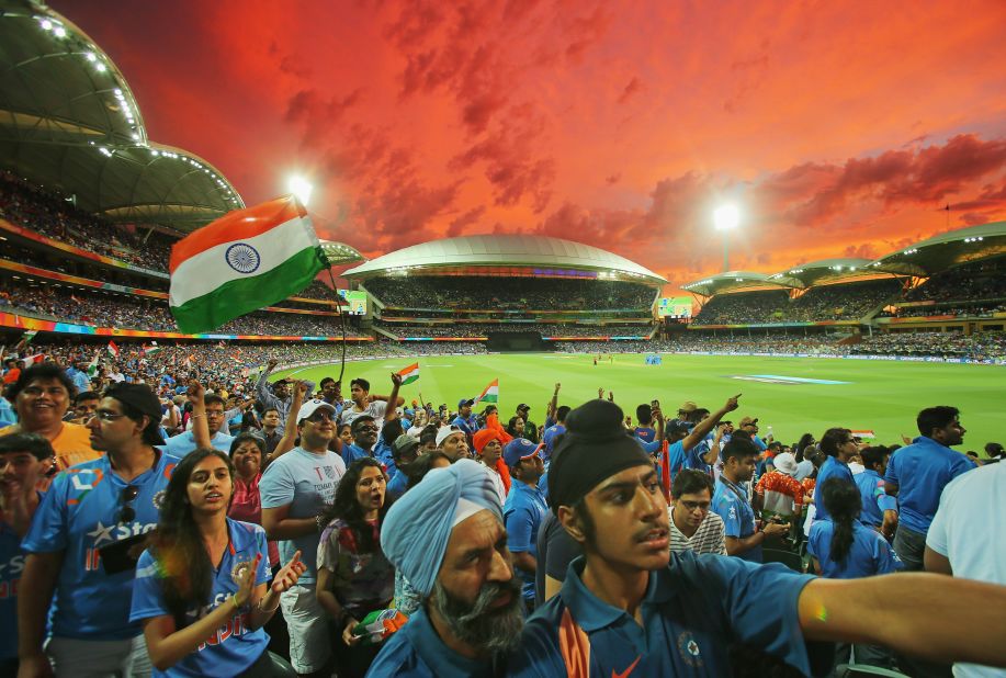 A bright red sky is the backdrop for Indian celebration at the historic Adelaide Oval in South Australia. 