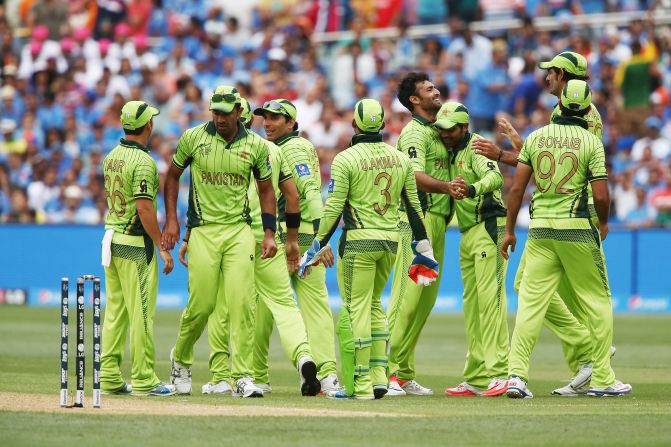 Sohail Khan is congratulated by his fellow Pakistan teammates on the way to five wickets in the Indian innings.