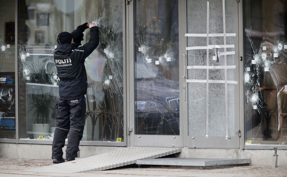 A police investigator works on February 15 at the scene of Saturday's shooting at a free speech event in Copenhagen. 
