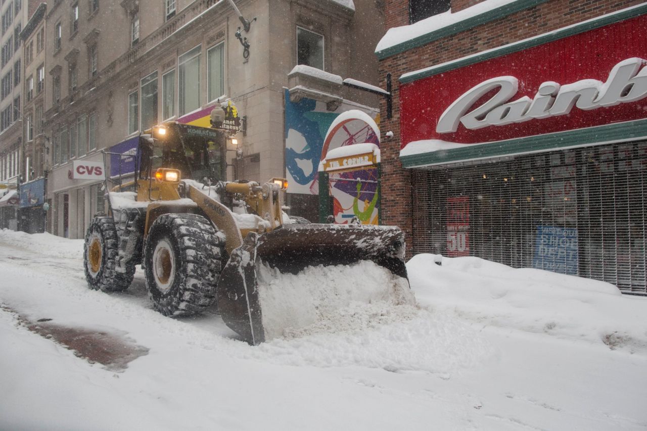 Heavy machinery is used to plow the Downtown Crossing area of Boston on February 15, after a winter storm dropped over a foot of snow on the city.
