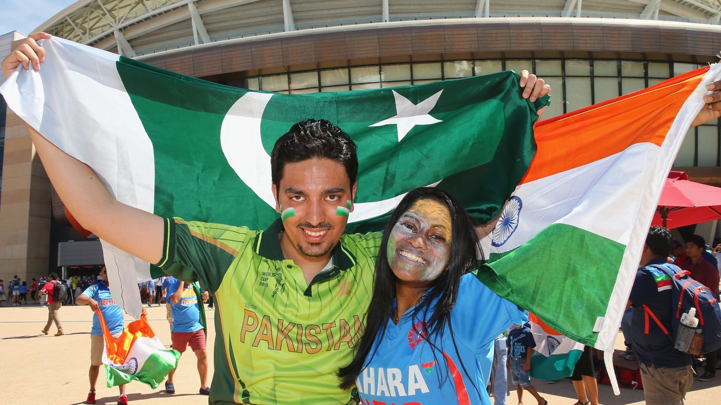 Pakistan and India cricket supporters pose with their flags outside of the Adelaide Oval.