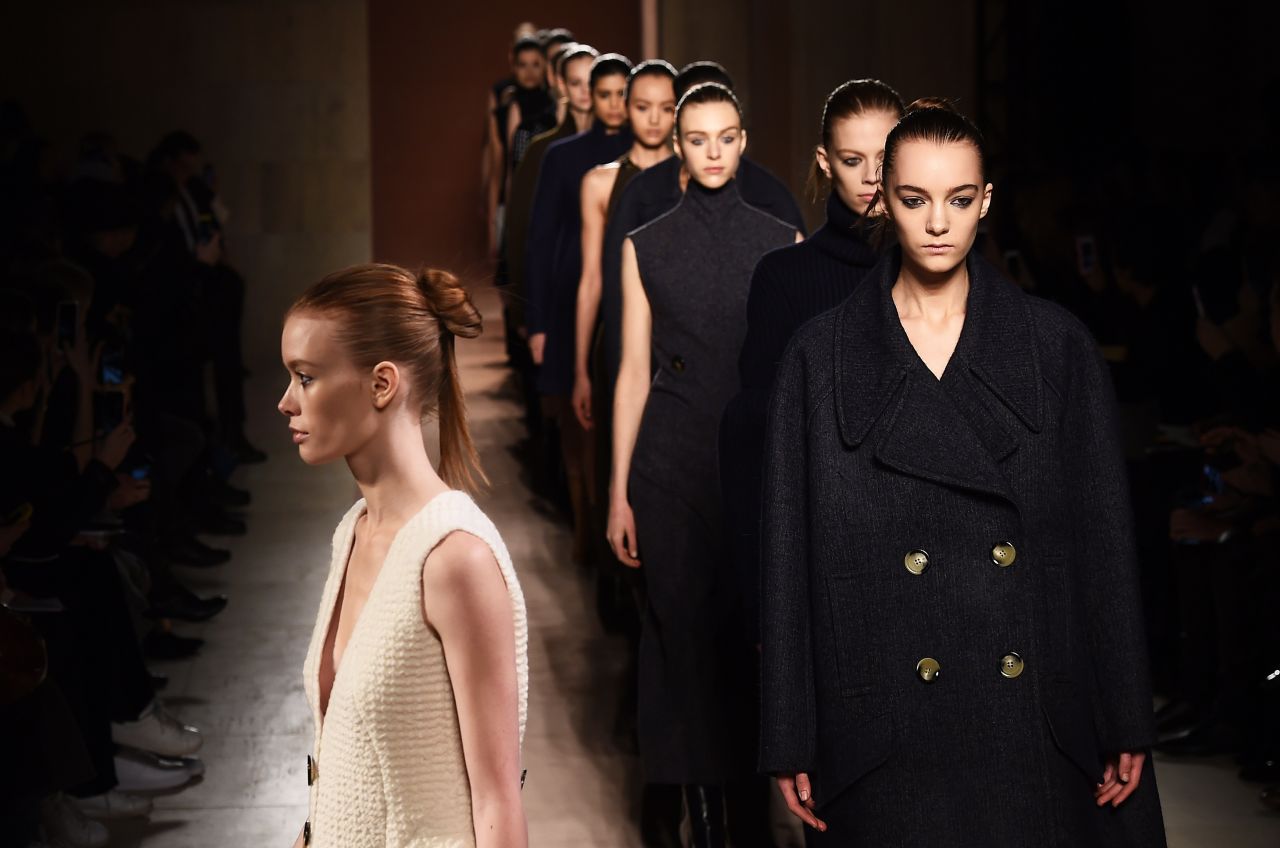 A model presents a boxy outerwear look by designer Victoria Beckham.