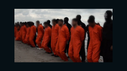 In a new propaganda video released Sunday, February 15 by ISIS, the group claims to have beheaded over a dozen members of Egypt's Coptic Christian minority on a Libyan beach. The release shows a mass execution with jihadists in black standing behind each victim -- all are dressed in an orange jumpsuit and handcuffed with zip ties.