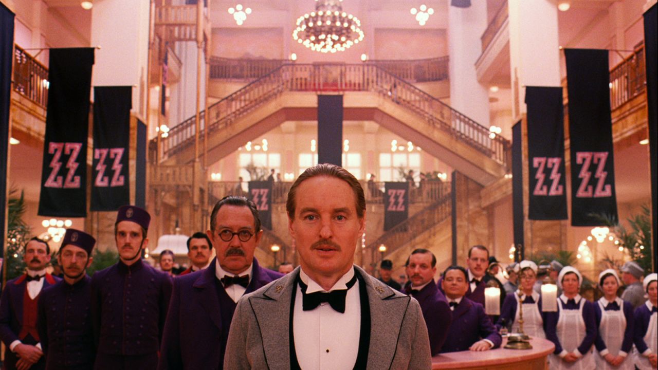 The Grand Budapest Hotel! It wasn't filmed in Budapest and the "hotel" and Republic of Zubrowka aren't even real. But director Wes Anderson's ode to swankier travel days, a legendary concierge and his faithful lobby boy sidekick make us want to pack our steamer trunks, hat boxes and portable wardrobes and waltz to a Victrola in a musty ballroom.