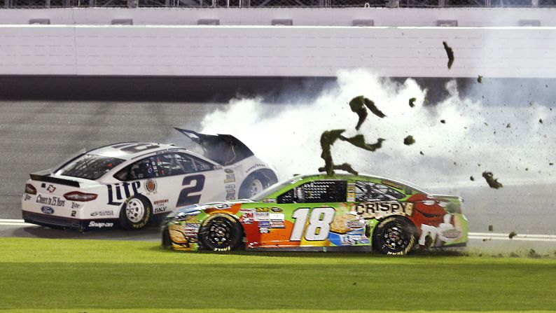 Kyle Busch (No. 18) drives through the infield grass to avoid hitting Brad Keselowski, who crashed into the wall during the Sprint Unlimited race Saturday, February 14, in Daytona Beach, Florida. Matt Kenseth won the exhibition race, which is an appetizer of sorts for the season-opening Daytona 500.