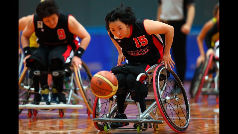 Mari Amimoto, a wheelchair basketball player from Japan, competes against Australia during an Osaka Cup game played Friday, February 13, in Osaka, Japan. 