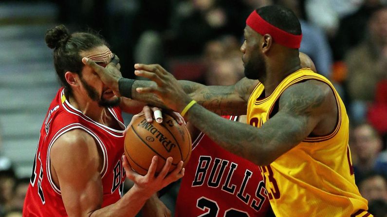Chicago's Joakim Noah is fouled by Cleveland's LeBron James during an NBA game in Chicago on Thursday, February 12.
