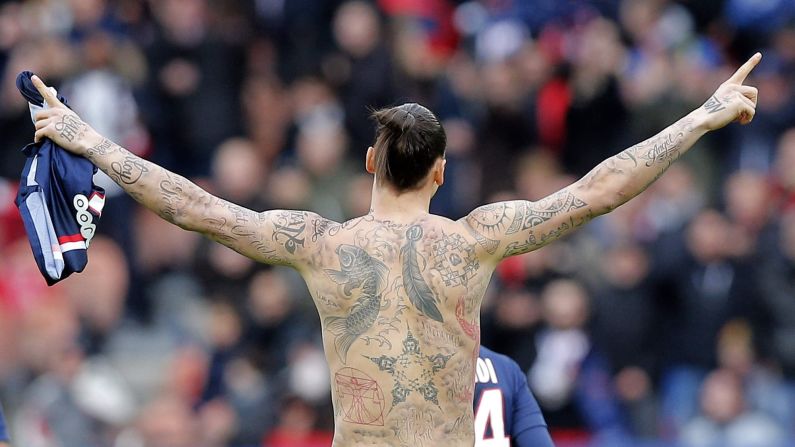 Zlatan Ibrahimovic, a striker for Paris Saint-Germain, celebrates a goal Saturday, February 14, during a French league match against Caen. To raise awareness of global hunger, Ibrahimovic had 50 names <a href="index.php?page=&url=http%3A%2F%2Fwww.dailymail.co.uk%2Fsport%2Ffootball%2Farticle-2954515%2FZlatan-Ibrahimovic-tattooed-names-50-starving-people-body.html" target="_blank" target="_blank">temporarily tattooed</a> around the permanent tattoos on his upper body. The names belong to people around the world who have been helped by the United Nations World Food Program.
