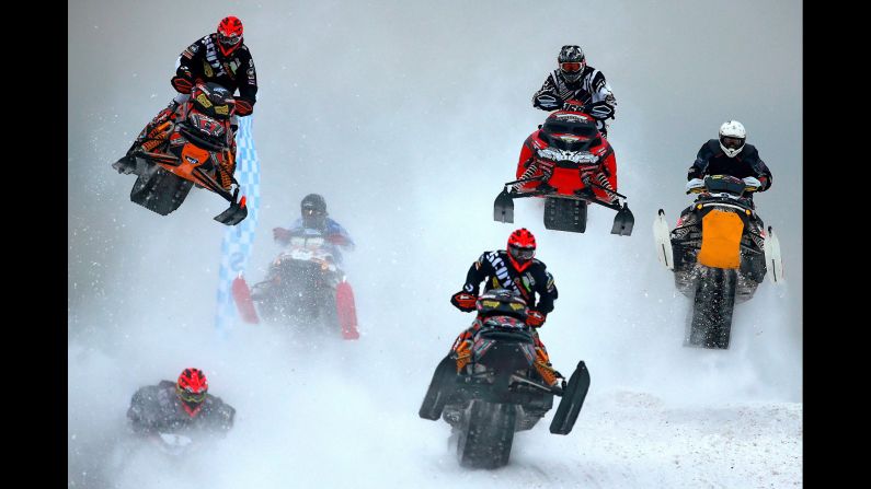 Competitors speed through wintry terrain in the Russian village of Shaldovo during the Snow Battle of Nations, a cross-country snowmobile race, on Saturday, February 14.
