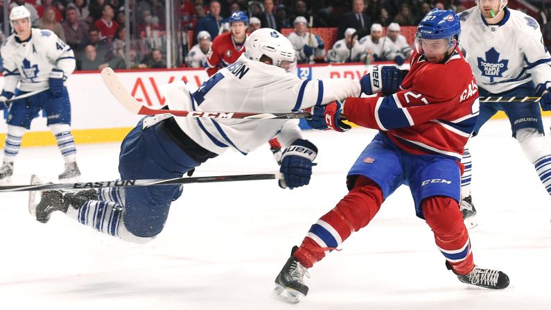 Montreal's Alex Galchenyuk fires a slap shot as Toronto's Cody Franson defends him during an NHL game Saturday, February 14, in Montreal, Quebec.