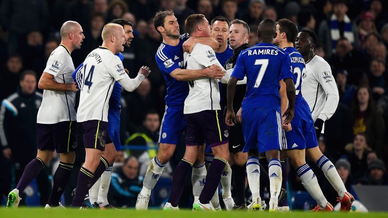 Chelsea's Branislav Ivanovic holds back Everton's James McCarthy as tempers flare during a Premier League match in London on Wednesday, February 11. Chelsea, the league leaders, won the home match 1-0.