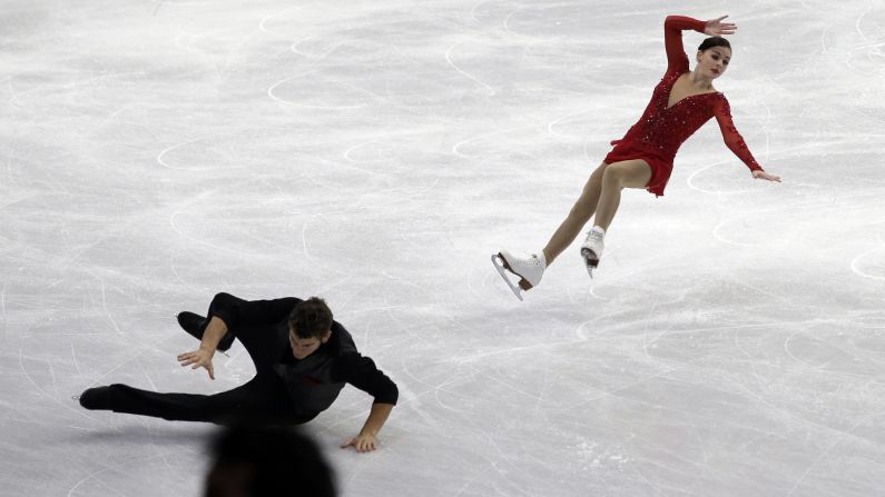 Brandon Frazier, left, falls as he and Haven Denney compete in the pairs competition Thursday, February 12, at the Four Continents Figure Skating Championships in Seoul, South Korea.