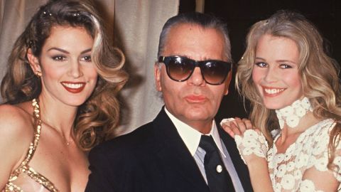 Crawford and supermodel Claudia Schiffer pose with fashion designer Karl Lagerfeld in Paris in 1993.