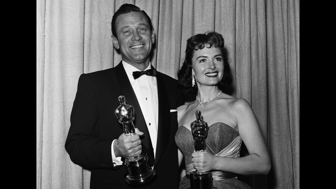 <strong>William Holden (1954):</strong> William Holden celebrates his best actor win for "Stalag 17" with best supporting actress winner Donna Reed at the Oscar ceremony in 1954. It was the actor's second nomination; his first was for Billy Wilder's 1950 classic "Sunset Boulevard."