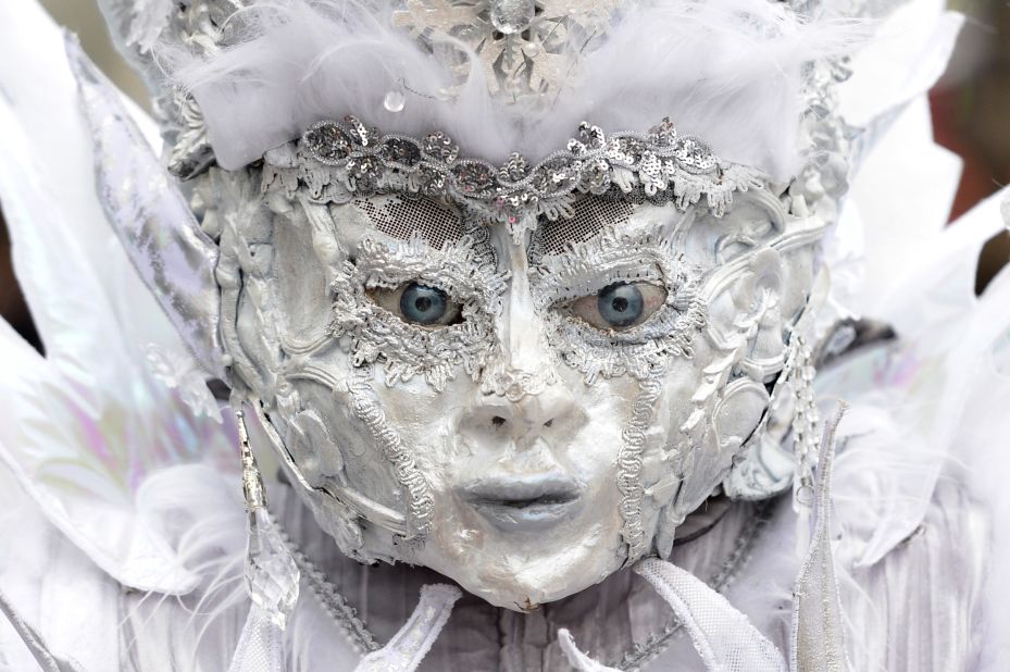 A masked participant walks through the streets in Lucerne, Switzerland, during a Carnival parade on February 16. Carnival is a circus-like celebration that traditionally occurs before Lent.