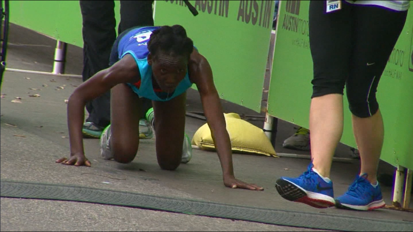 runner crawls to the finish line