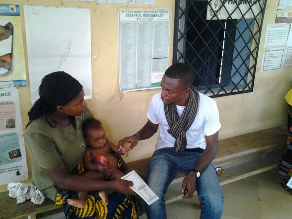 Cameroonian entrepreneur Alain Nteff, seen in this picture with a mother and her baby, is the founder of a startup is fighting to eradicate maternal and infant mortality across the country. 