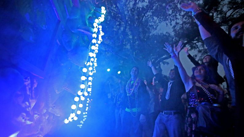 Revelers cheer for beads during the Krewe of Proteus parade in New Orleans on Monday, February 16. The day is known as Lundi Gras, the day before Mardi Gras.