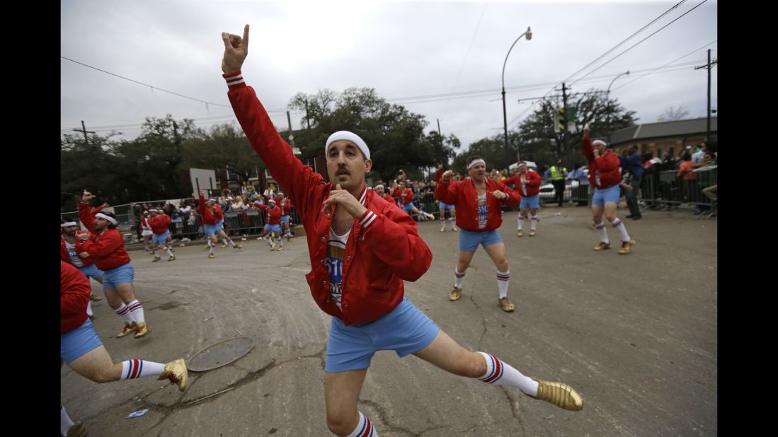 Members of the all-male dance group "The 610 Stompers" perform during the Krewe of Proteus Mardi Gras parade on February 16.