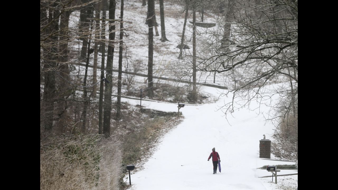 A sledder climbs up a hill in Nashville on February 16.