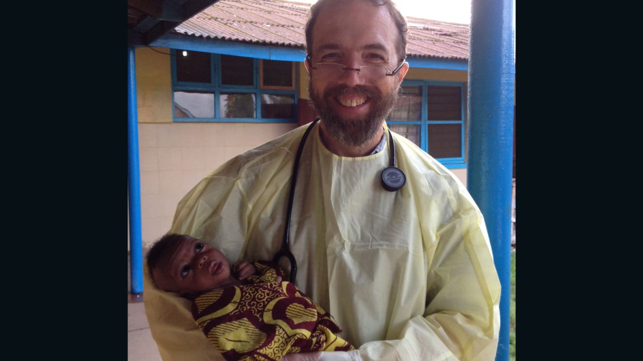 Dr. Rick Sacra holds the baby "Noah" on the morning of his discharge.