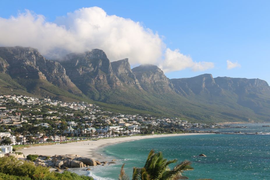 The Twelve Apostles mountains rise above Camps Bay Beach in Camps Bay, South Africa. The beach beauty is No. 11 on the global beaches list.