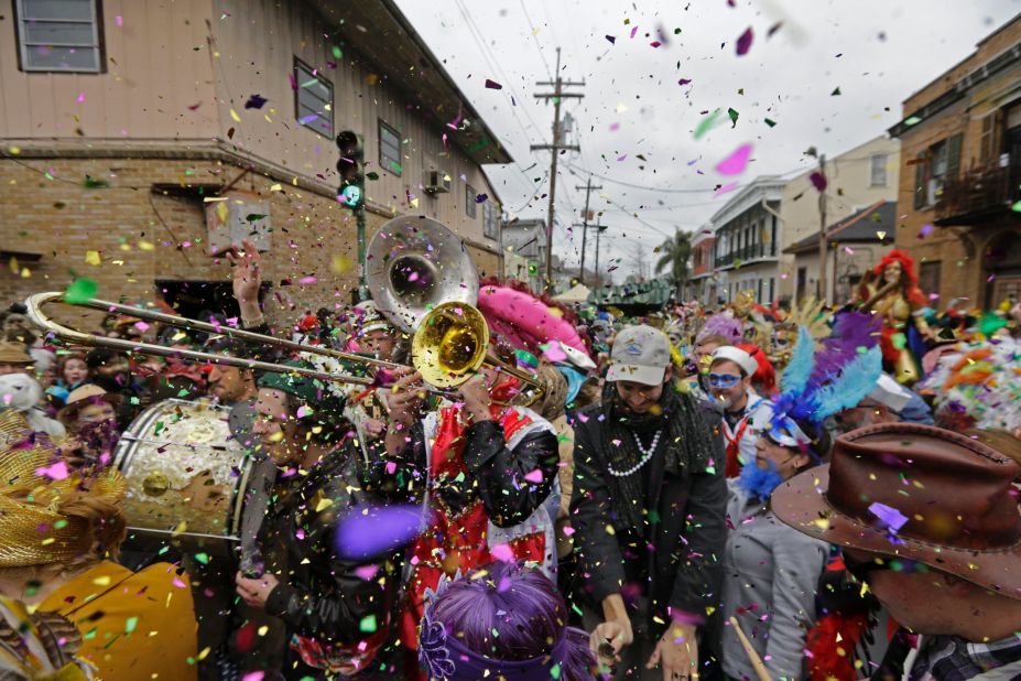 Revelers in New Orleans play brass-band music during a Mardi Gras parade on Tuesday, February 17, 2015.