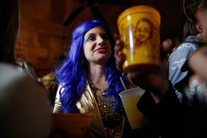 Mardi Gras revelers in New Orleans make their way from the Bywater to the French Quarter on February 17.