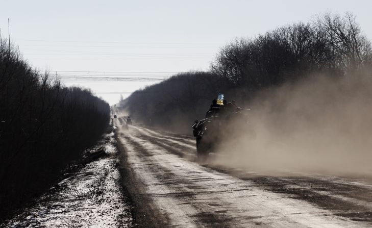 A Ukrainian armored vehicle passes on a road stretching away from the town of Artemivsk towards Debaltseve on February 17. 