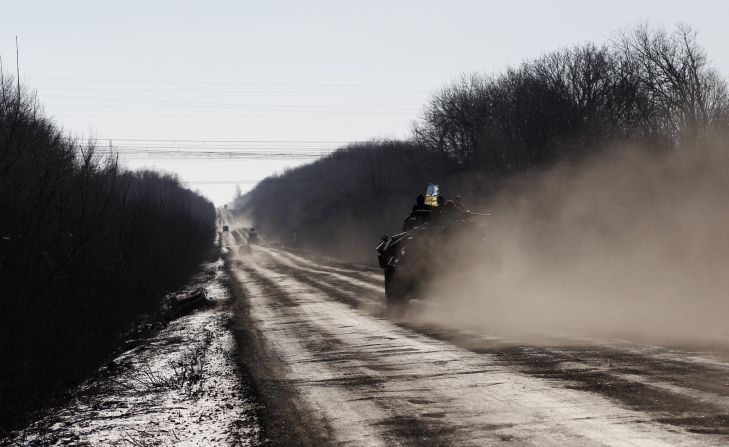 A Ukrainian armored vehicle passes on a road stretching away from the town of Artemivsk towards Debaltseve on February 17.