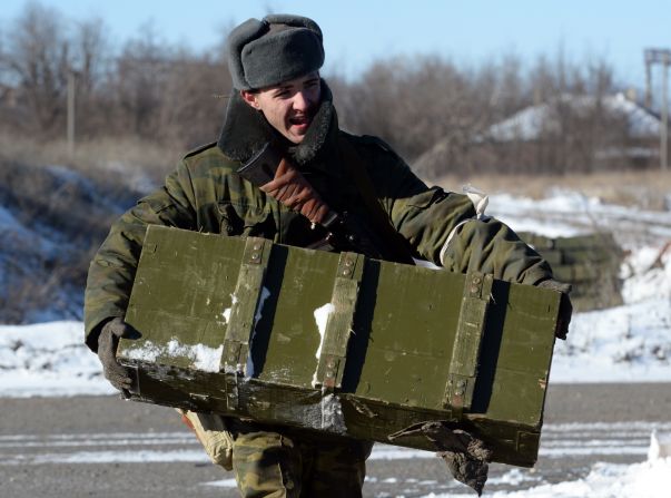 A pro-Russian rebel carries ammunition to be loaded onto a truck near Debaltseve on February 17.