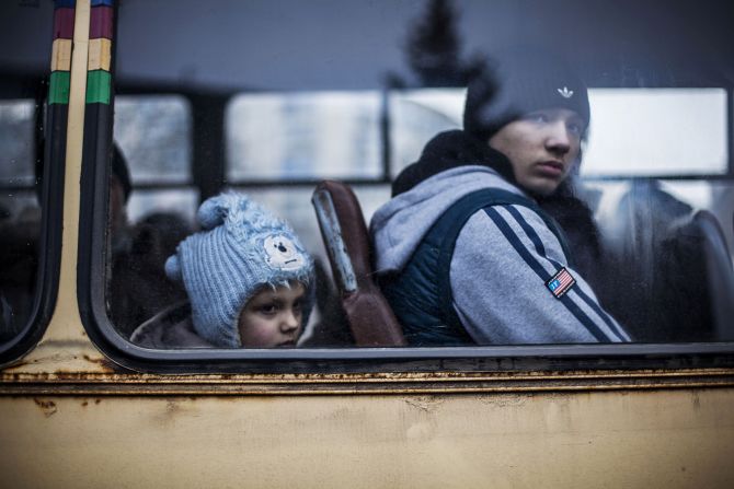 Ukrainian children sit in a bus before fleeing Debaltseve, in the Donetsk region, on February 3, 2015. <a href="index.php?page=&url=http%3A%2F%2Fcnn.com%2F2015%2F02%2F18%2Feurope%2Fukraine-conflict%2F">Ukraine's military said Wednesday </a>that 80% of Ukrainian armed forces have now pulled out of a strategic railroad hub that's been the focus of bitter fighting with pro-Russian separatists.
