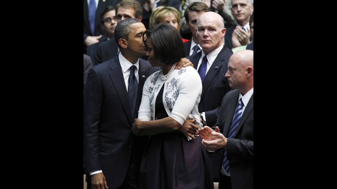 U.S. President Barack Obama kisses his wife, Michelle, during an event in Tucson, Arizona, in 2011. To her right is Secret Service agent Joe Clancy. A White House official said that Clancy, the former chief of Obama's personal security, has been chosen by the President to lead the Secret Service. Clancy has been the agency's interim director for the past four months.