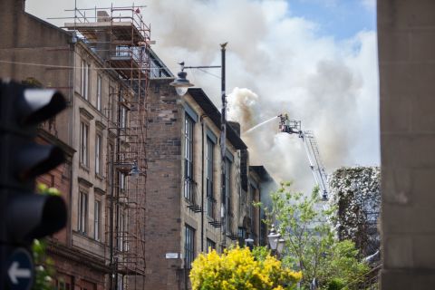 On the 23rd of May 2014, flames raged and plumes of smoke rose high above the Garnethill district of Glasgow, Scotland. <br /><br />The quaint city-center neighborhood is home to a mix of plush new-build flats as well as century-old red brick tenement blocks. It's also the base of the internationally-renowned Glasgow School of Art. <br /><br />Designed by Charles Rennie Mackintosh, widely regarded as one of the leading figures of late 19th and early 20th Century design and architecture, it was in the art school the blaze originated. Fire tore through the building, destroying studios, student's work and the majestic library that bears Mackintosh's name.<br /><br />Fire-fighters ensured that much of the school's structure was preserved, however the exquisite interiors and intricacies of the library's cherished decor were destroyed.<br />Last week, Getty Images photographer Jeff J. Mitchell was given access to the site which is currently being refurbished.<br /><br />At the same time, a new exhibition celebrating Mackintosh's life's work and enduring influence opened at the Royal Institute of British Architects in London.<br />