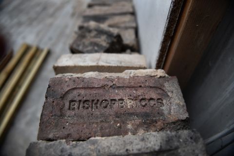 A charred brick bearing the name of the suburb of Bishopbriggs in the Mackintosh Library at the Glasgow School of Art.