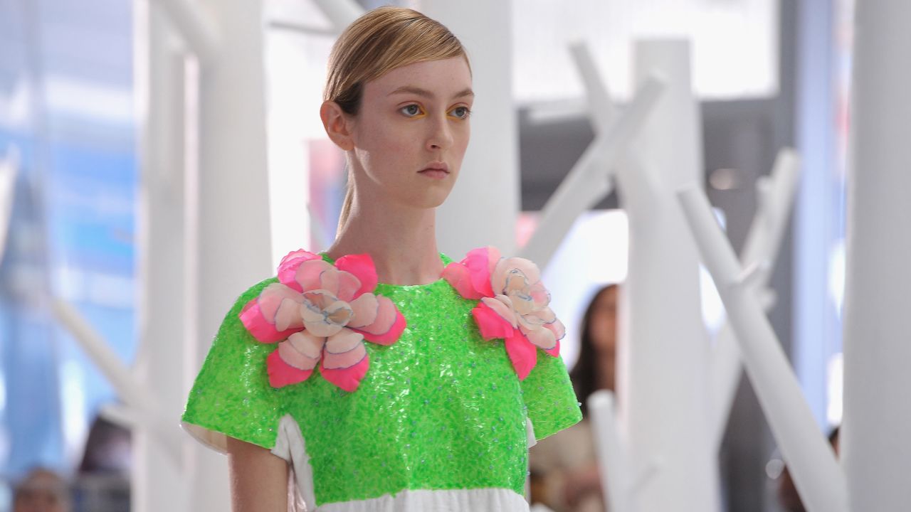 Josep Font, the creative director of DELPOZO, incorporated handcrafted fabric flowers on dresses for his artistic and colorful collection.