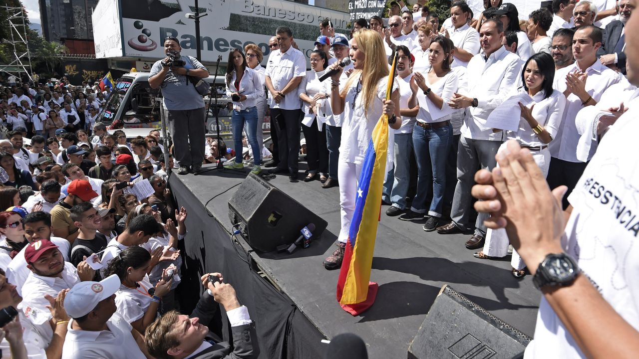 Lilian Tintori (C) wife of jailed opposition leader Leopoldo Lopez speaks during a demonstration in Caracas on February 18, 2015. Venezuelan opposition leader Leopoldo Lopez is imprisoned since February 18th 2014, accused of violent protests in 2014 that left 43 dead people. AFP PHOTO/JUAN BARRETO (Photo credit should read JUAN BARRETO/AFP/Getty Images)