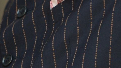 This close-up shows the details of the Indian Prime Minister Narendra Modi's suit bearing his own name.