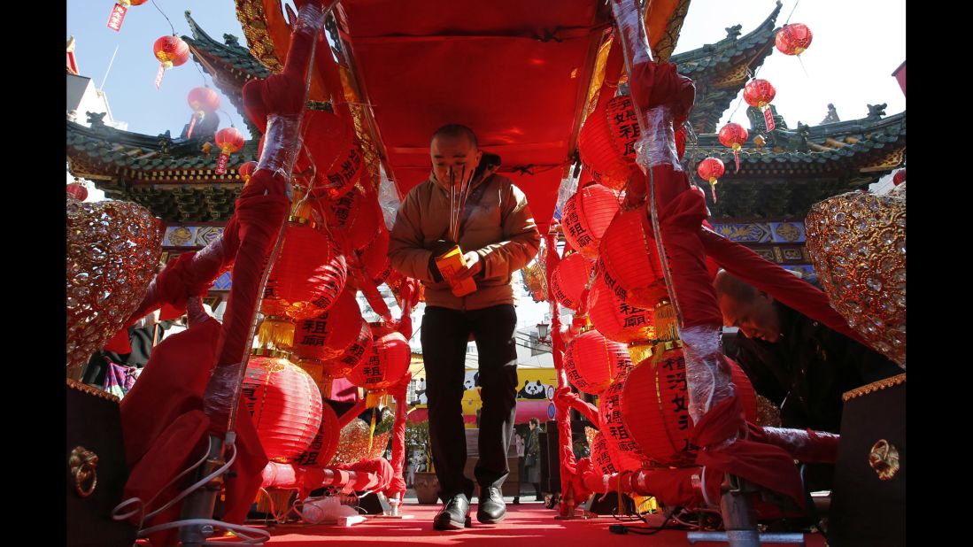 A man walks through red lantern decorations at a temple near Tokyo on February 19.
